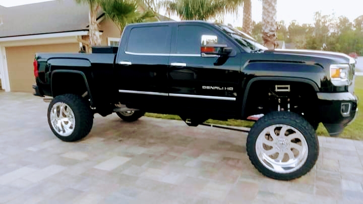 Glossy black GMC Denali truck freshly detailed by We Do It All Detail in Stockbridge, GA
